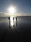 SX25564 Matt, Libby and Jenni walking on the beach.jpg